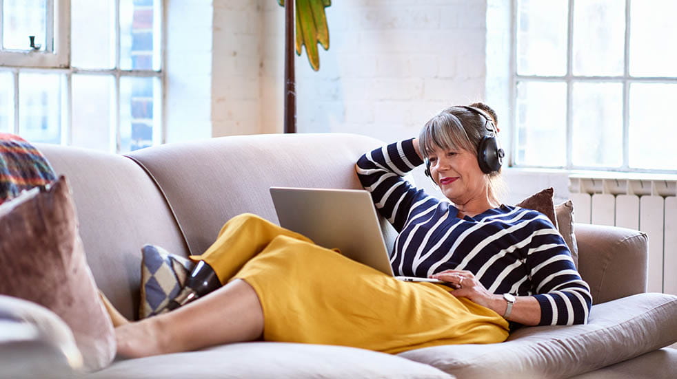 Best summer podcasts woman listening to headphones